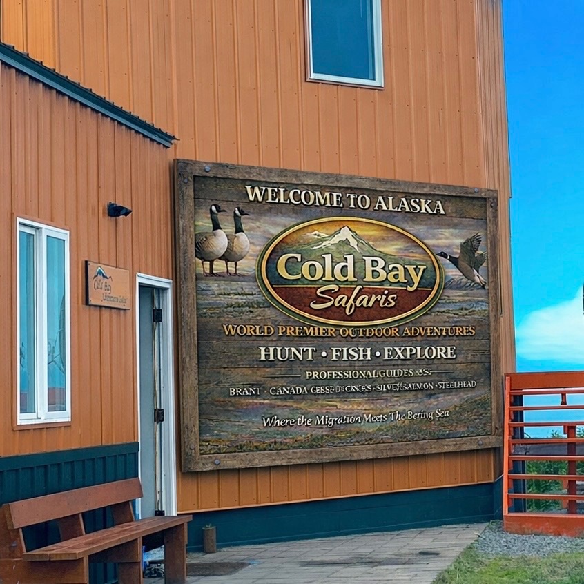 Welcome to Alaska Cold Bay Safaris sign at the lodge